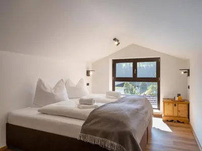 Ein Bett oder Betten in einem Zimmer der Unterkunft Alpine Homes - Hopfgarten