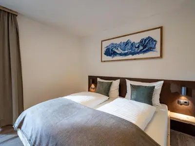 Ein Bett oder Betten in einem Zimmer der Unterkunft Alpine Homes - Hopfgarten