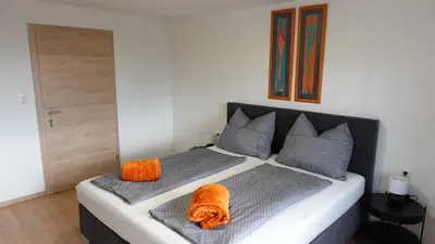 Ein Bett oder Betten in einem Zimmer der Unterkunft JOE's Appartement