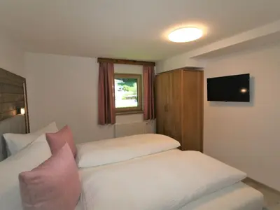 Ein Bett oder Betten in einem Zimmer der Unterkunft Apartment Geislerhof by Interhome