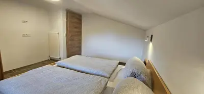 Ein Bett oder Betten in einem Zimmer der Unterkunft Ferienwohnungen Martlhof