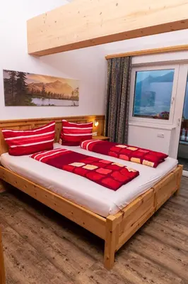 Ein Bett oder Betten in einem Zimmer der Unterkunft Ferienwohnungen Hinterstein