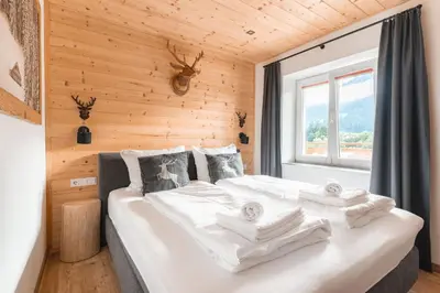 Ein Bett oder Betten in einem Zimmer der Unterkunft Westendorf Alpen Lodge