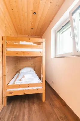 Ein Bett oder Betten in einem Zimmer der Unterkunft Westendorf Alpen Lodge