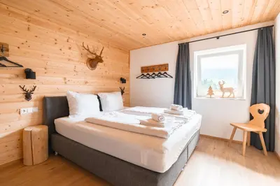 Ein Bett oder Betten in einem Zimmer der Unterkunft Westendorf Alpen Lodge