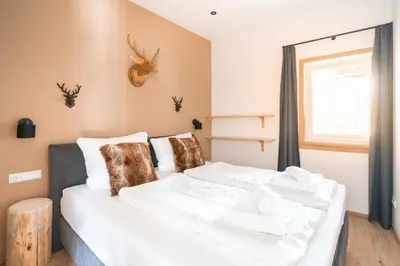 Ein Bett oder Betten in einem Zimmer der Unterkunft Westendorf Alpen Lodge
