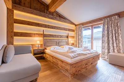 Ein Bett oder Betten in einem Zimmer der Unterkunft Dorfresort Kitzbühel by ALPS RESORTS