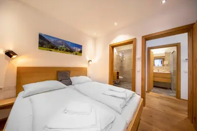 Ein Bett oder Betten in einem Zimmer der Unterkunft FamilienWohnung Wildspitze am Sonnenhang