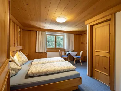 Ein Bett oder Betten in einem Zimmer der Unterkunft Bauernhof Niederfilzboden