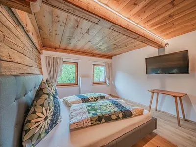 Ein Bett oder Betten in einem Zimmer der Unterkunft Hohe Salve L