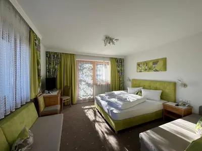 Ein Bett oder Betten in einem Zimmer der Unterkunft Pension Dorferwirt
