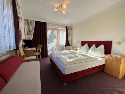 Ein Bett oder Betten in einem Zimmer der Unterkunft Pension Dorferwirt