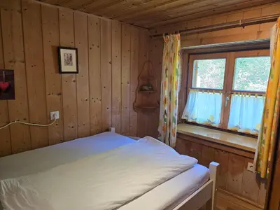 Ein Bett oder Betten in einem Zimmer der Unterkunft Lederer Häus'l, Ferienwohnungen