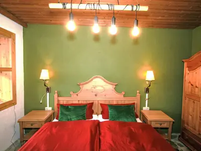 Ein Bett oder Betten in einem Zimmer der Unterkunft Apartment Chalet Astholz by Interhome