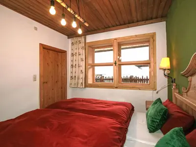 Ein Bett oder Betten in einem Zimmer der Unterkunft Apartment Chalet Astholz by Interhome
