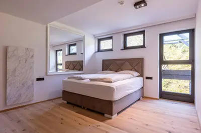 Ein Bett oder Betten in einem Zimmer der Unterkunft Saalbach Suites by ALPS RESORTS
