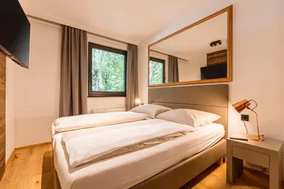 Ein Bett oder Betten in einem Zimmer der Unterkunft Saalbach Suites by ALPS RESORTS