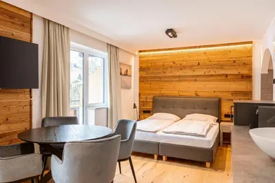 Ein Bett oder Betten in einem Zimmer der Unterkunft Saalbach Suites by ALPS RESORTS