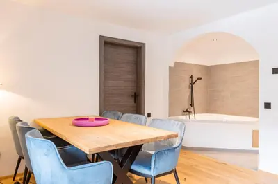 Ein Bett oder Betten in einem Zimmer der Unterkunft Saalbach Suites by ALPS RESORTS