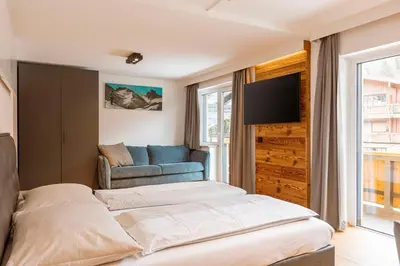 Ein Bett oder Betten in einem Zimmer der Unterkunft Saalbach Suites by ALPS RESORTS