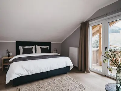 Ein Bett oder Betten in einem Zimmer der Unterkunft VAYA Post Saalbach