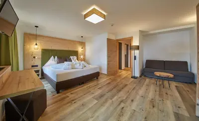 Ein Bett oder Betten in einem Zimmer der Unterkunft Hotel Hubertushof