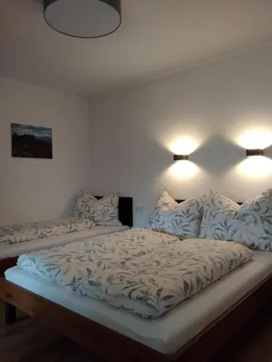 Ein Bett oder Betten in einem Zimmer der Unterkunft Apart Bergauf