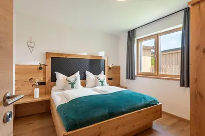 Ein Bett oder Betten in einem Zimmer der Unterkunft Kaiserresidenz Ellmau