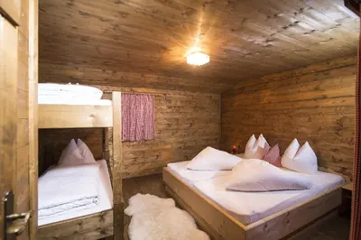 Ein Bett oder Betten in einem Zimmer der Unterkunft Hütte - Ferienhaus Bischoferhütte für 2-10 Personen