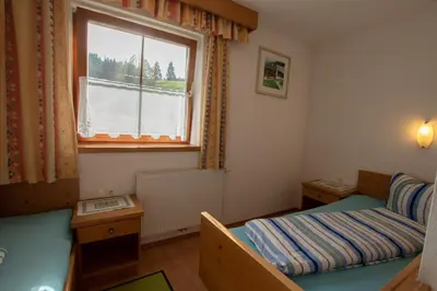 Ein Bett oder Betten in einem Zimmer der Unterkunft Ferienwohnung zum Mühltal