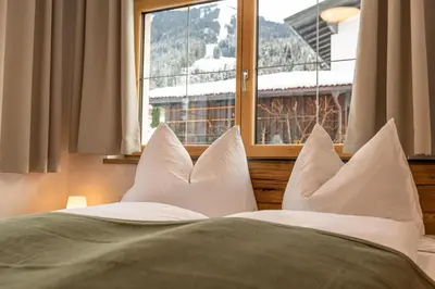 Ein Bett oder Betten in einem Zimmer der Unterkunft Tiroli