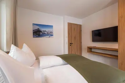 Ein Bett oder Betten in einem Zimmer der Unterkunft Tiroli