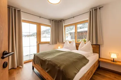 Ein Bett oder Betten in einem Zimmer der Unterkunft Tiroli