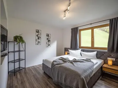 Ein Bett oder Betten in einem Zimmer der Unterkunft Zillertal Suites