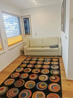 Ein Sitzbereich in der Unterkunft Apartment Aigner