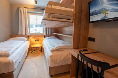 Ein Bett oder Betten in einem Zimmer der Unterkunft Filzsteinresort Wohnungen Top 1