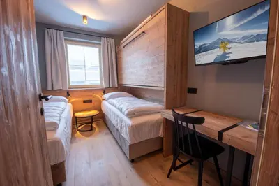 Ein Bett oder Betten in einem Zimmer der Unterkunft Filzsteinresort Wohnungen Top 1