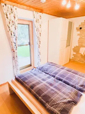 Ein Bett oder Betten in einem Zimmer der Unterkunft Ferienwohnung Steinberger