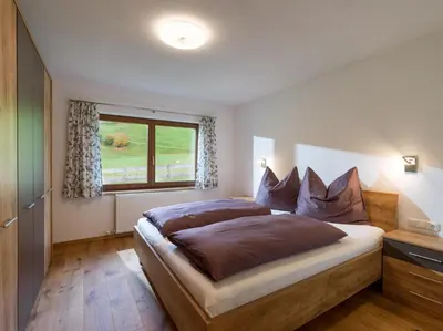 Ein Bett oder Betten in einem Zimmer der Unterkunft Ferienhaus Widmann