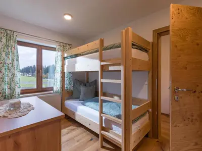 Ein Bett oder Betten in einem Zimmer der Unterkunft Ferienhaus Widmann