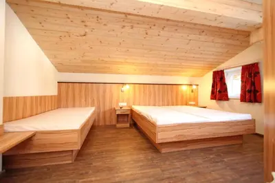 Ein Bett oder Betten in einem Zimmer der Unterkunft Ferienwohnung Königsleiten 2 - Top 1