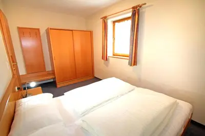 Ein Bett oder Betten in einem Zimmer der Unterkunft Ferienwohnung Königsleiten 2a - Top UG