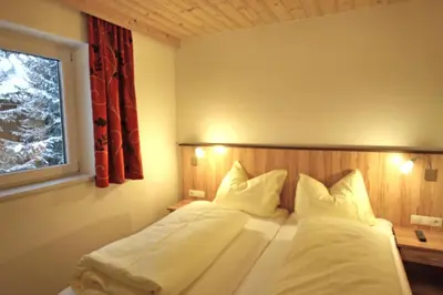 Ein Bett oder Betten in einem Zimmer der Unterkunft Ferienwohnung Königsleiten 2 - Top 3
