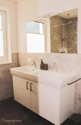 Ein Badezimmer in der Unterkunft TheView Green