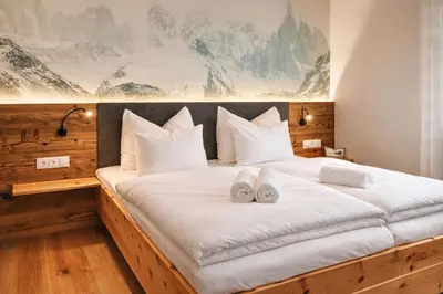 Ein Bett oder Betten in einem Zimmer der Unterkunft ZWEITE HEIMAT - by AlpenLuxus Collection