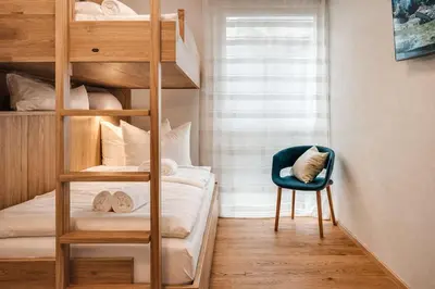 Ein Bett oder Betten in einem Zimmer der Unterkunft ZWEITE HEIMAT - by AlpenLuxus Collection