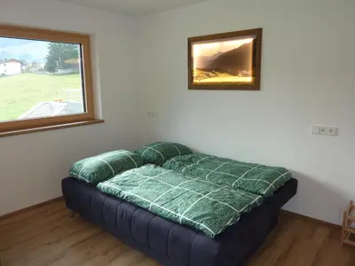 Ein Bett oder Betten in einem Zimmer der Unterkunft Apart MARI