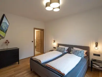 Ein Bett oder Betten in einem Zimmer der Unterkunft Bergzeit Appartement