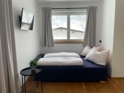 Ein Bett oder Betten in einem Zimmer der Unterkunft Bergzeit Appartement