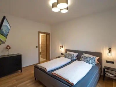 Ein Bett oder Betten in einem Zimmer der Unterkunft Bergzeit Appartement